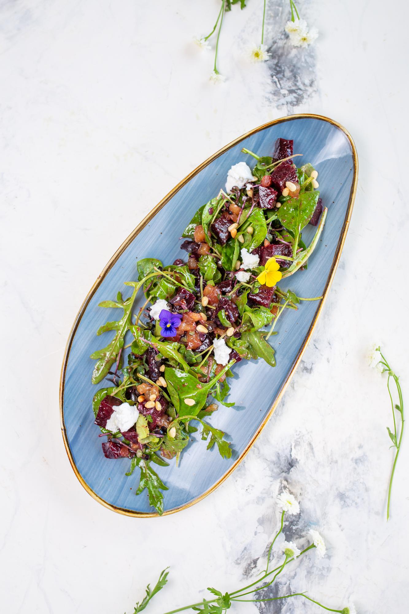 Rustic plated salad with edible flowers